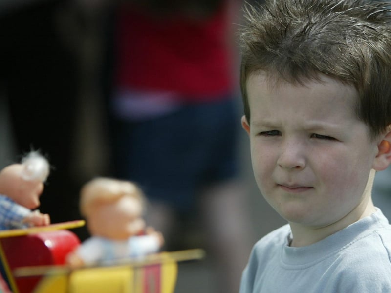 Kohlin McGranaghan watchs in amazement at the miniature fairground during the Strabane Hiring Fair Day carnival. (0107JB56)