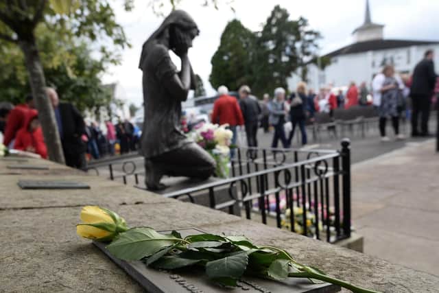 A previous service to mark the Claudy bombings at the memorial garden at the Market Square car park. Photo Colm Lenaghan/Pacemaker Press