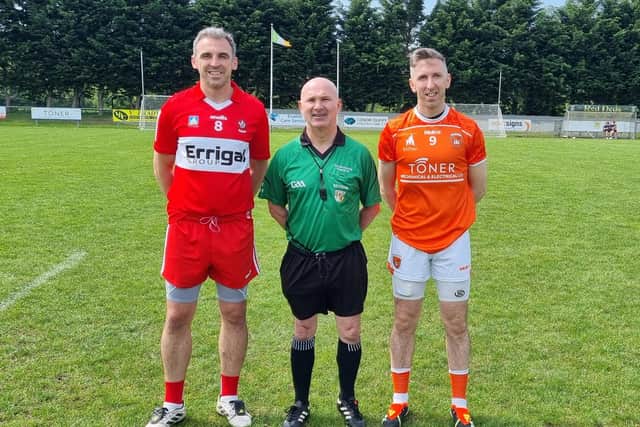 The 2024 Derry Masters captain Kevin McGuckin takes the coin toss in Pearse Og Park on Saturday.