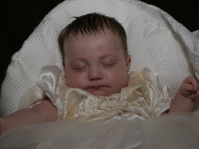 Allie-Lee Simpson's baptism with family.