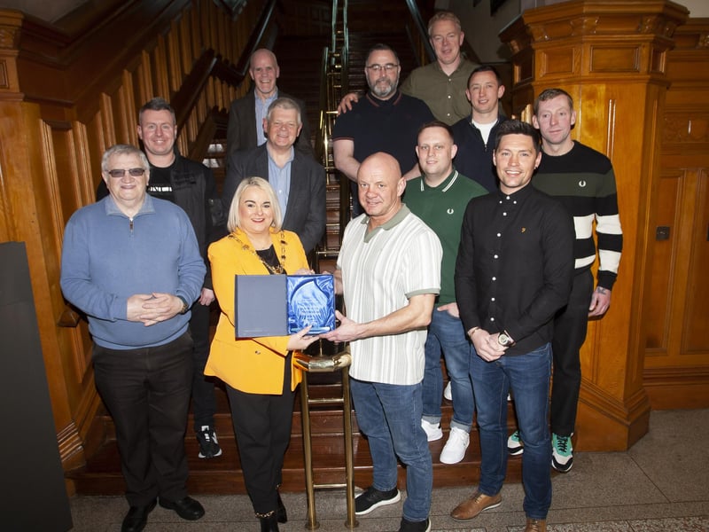 The Mayor of Derry City and Strabane District Council, Sandra Duffy makes a special presentation to Liam McLaughlin, St. Joseph’s Boxing Club to mark the club’s celebration of 30 years in existence, during a reception in the Guildhall on Thursday night last. Included are senior club members.
