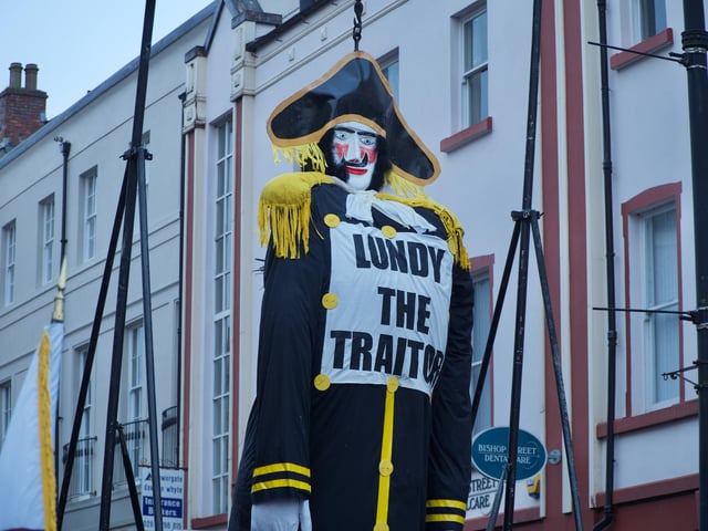 'Lundy the traitor' standing in Bishop Street before it was set on fire on Saturday.