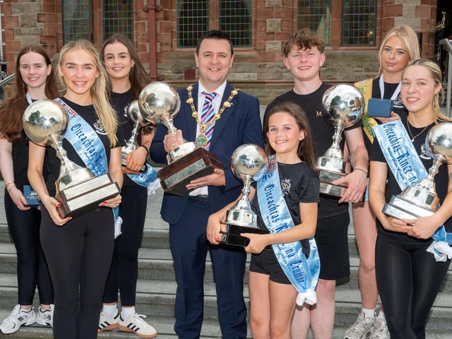 Derry City and Strabane District Council Mayor, Councillor Ruairí McHugh welcomed members of the McConomy-Bradley-Doherty Academy to the Guildhall as they celebrate their outstanding success at the recent World Championships in Dublin. Globe and Medal Winners pictured from left, Lusai Gillespie, Caitlin Murray, Sophie Gillespie, Amy Gallagher, Gary O'Doherty, Tegan McConomy and Chloe McConomy-Bradley. Picture Martin McKeown. 19.06.25