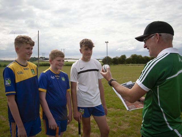 Burt coach Paul Johnson explains to these youth players the rules for one of the skills test.