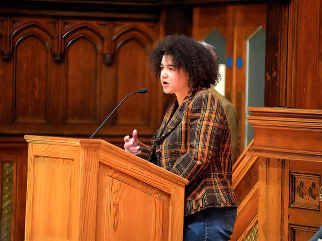 Abby Oliveria recites her poem celebrating Radio Foyle and its value to the community at a public meeting, held in the Guildhall on Wednesday evening, opposing proposed cuts to jobs and services at the local radio station. George Sweeney. DER2301GS – 22