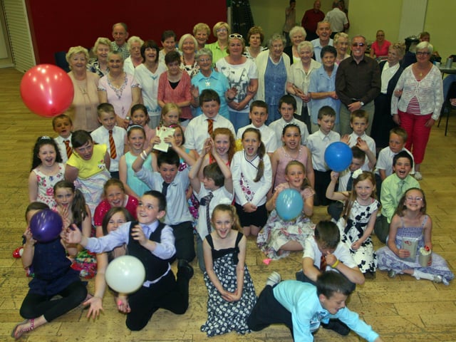 2010: Pupils from St. Eugene's PS and Fountain PS pictured with a section of the pensioners at a Heritage Tea Dance in the Gasyard. 2506JM12