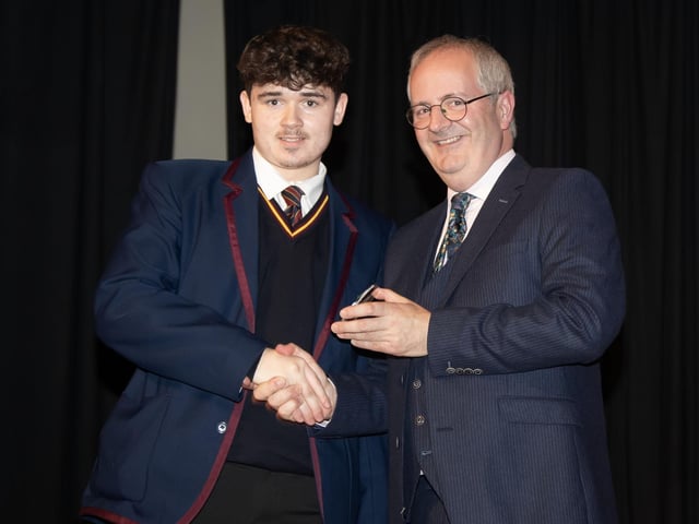 Spencer Cole, pictured receiving the Athletics Awrd from Mr John Harkin, Principal.