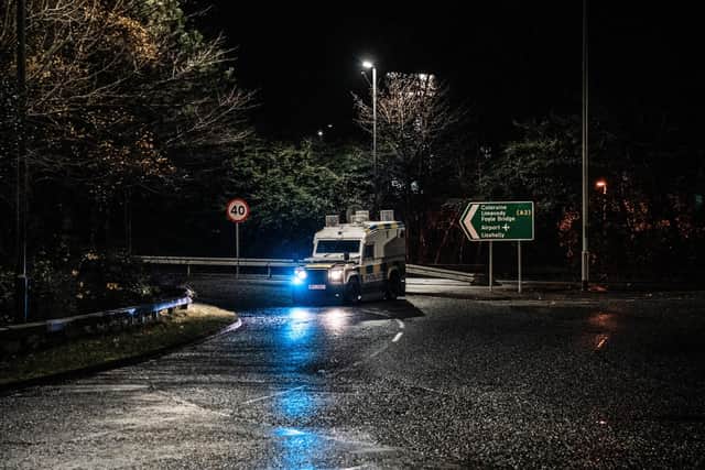 Police in the Waterside on Sunday night. Photo: Aodhán Roberts.