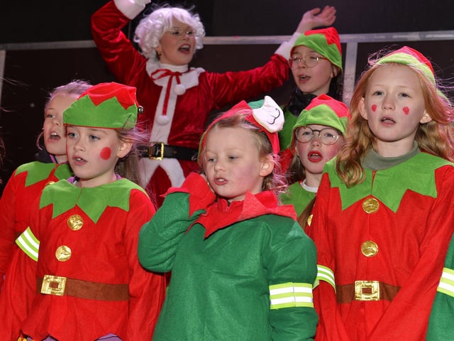Children from Culmore Kids Club sing Christmas carols at the Culmore Community Hub on Friday night. Photo: George Sweeney