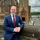 Minister Lyons pictured on The Derry Walls.