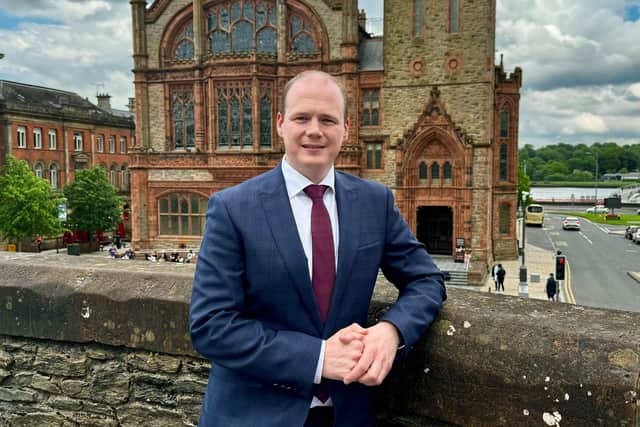 Minister Lyons pictured on The Derry Walls.