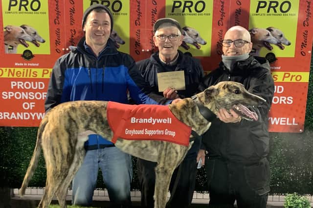 The end of the month bonus race winner Drumcrow Icon with from left; Roy Ruddy, his father Harold Ruddy who is accepting the £50 bonus from Patsy Doyle from the BGSG.