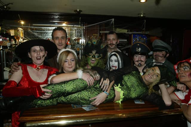 Staff of the Linenhall Bar get into the spirit of things. (0311JB53):20 YEARS ON: Halloween celebrations in Derry in 2003
