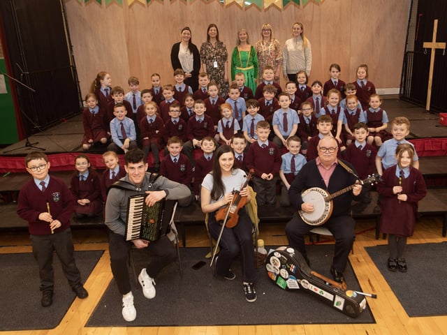 Pupils from St. John's PS pictured before taking part in a ceili dance session at the school on Wednesday afternoon. Included are members of the cce Baile na gCailleach who played for the pupils. The event was part of Feile Derry's Equinox Festival.