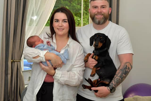 Toireasa and Barry McGavigan pictured with their baby girl Cobhlaith and Hiro their dog. Photo: George Sweeney. DER2319GS – 38