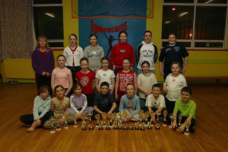 Members of Dymensions Dance Club, at St Mary's YC, Creggan, who collected trophies and medals and the recent Clonmany Disco Dancing Competitions, pictured with their dance teacher Linda Brady.