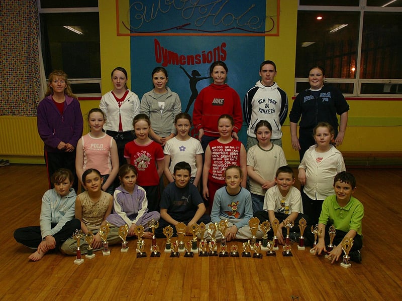 Members of Dymensions Dance Club, at St Mary's YC, Creggan, who collected trophies and medals and the recent Clonmany Disco Dancing Competitions, pictured with their dance teacher Linda Brady.