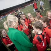 First Minister Michelle O'Neill has a chat with some of the Foyle Cup competitors at Brandywell.