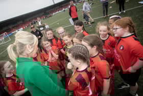 First Minister Michelle O'Neill has a chat with some of the Foyle Cup competitors at Brandywell.