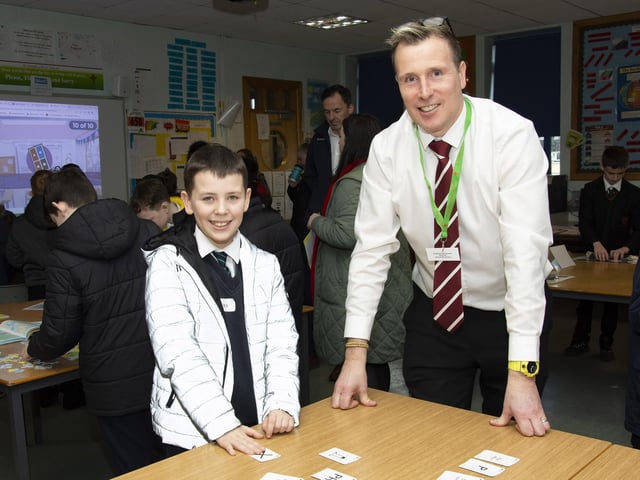 St. Joseph’s Boys' School Mr. Maude in conversation with Callum Kerrigan, Good Shepherd PS on Friday.