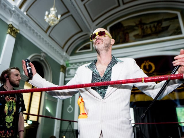 This wrestler looks for a reaction from the crowd.