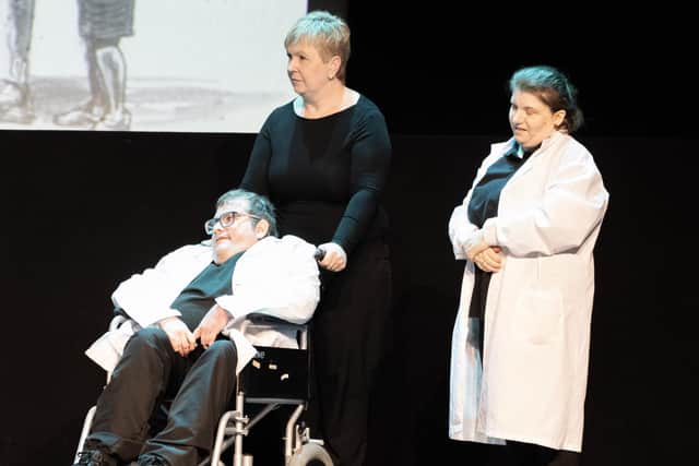 Darren Bond pictured with Karen Burnett, carer and Catherine Campbell performing in The Great Dictator