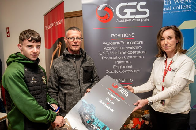 Tiarnan and Paul Fox learn about apprenticehips from Paula Bulter from GES at North West Regional College's Apprenticeship showcase at Springtown campus as part of NI Apprenticeship week 2024. 