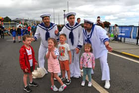 Jamie, Emilie, Harrison and Erin pictured with the singing sailors at the Foyle Maritime Festival. Photo: George Sweeney.  DER2229GS – 056