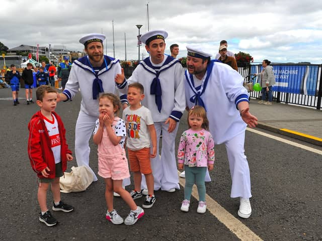 Jamie, Emilie, Harrison and Erin pictured with the singing sailors at the Foyle Maritime Festival. Photo: George Sweeney.  DER2229GS – 056