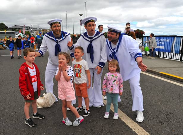 Jamie, Emilie, Harrison and Erin pictured with the singing sailors at the Foyle Maritime Festival. Photo: George Sweeney.  DER2229GS – 056