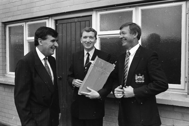 Derry City manager Jim McLaughlin and Chairman Ian Doherty chat with Manchester United manager Alex Ferguson
