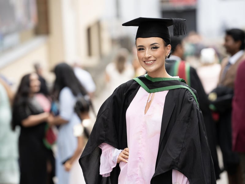 Alanna Hall from Banbridge County Down celebrates as she graduates with a degree in Social Work from Ulster University in Derry on Monday July 8.  (Photo: Nigel McDowell / Ulster University)