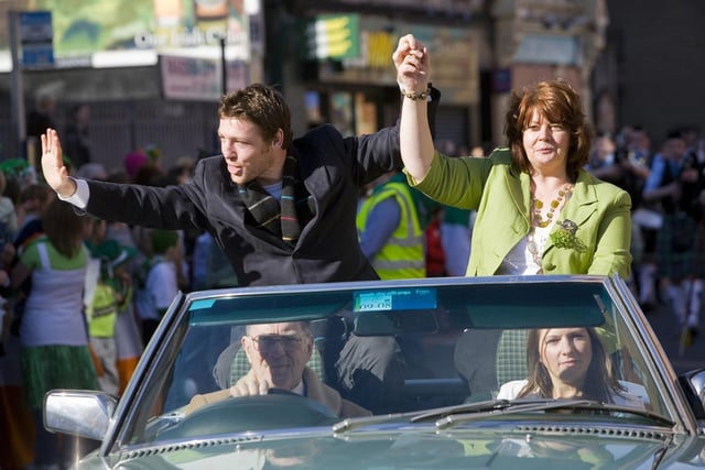 Derry's professional boxer John Duddy  with Deputy Mayor Patricia Logue salutes the thousands of people who lined the route of the St. Patrick's Day Parade