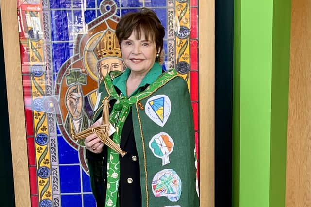 Dana in St. Brigid's cloak in the St. Patrick's Centre.