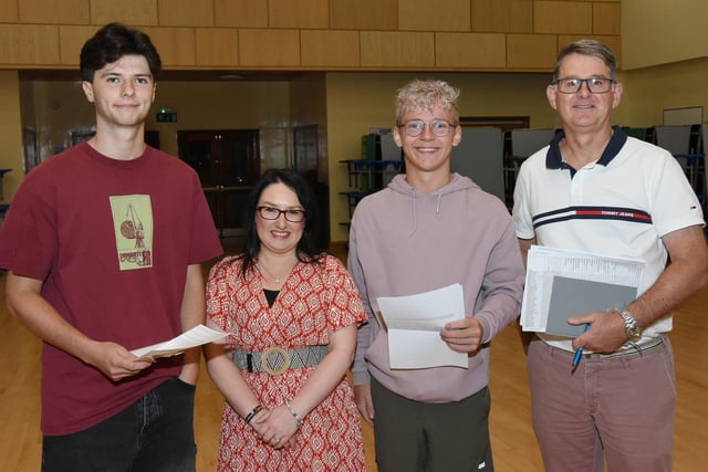 St Columb's College A Level students, Rory Boyle and Aaron McCrudden, pictured with Vice- Principals Caroline McLaughlin and Brian Keys on A Level Results Day 2023.