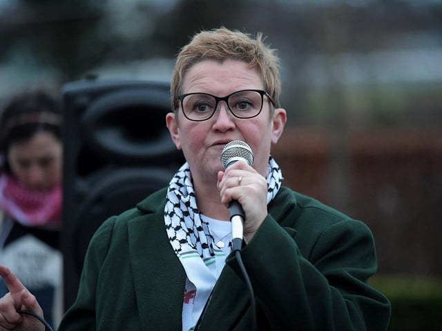 Catherine Hutton, Derry IPSC , speaking at the Holocaust Memorial Day vigil for Gaza, held in the Peace Garden, on Saturday afternoon. Photo: George Sweeney