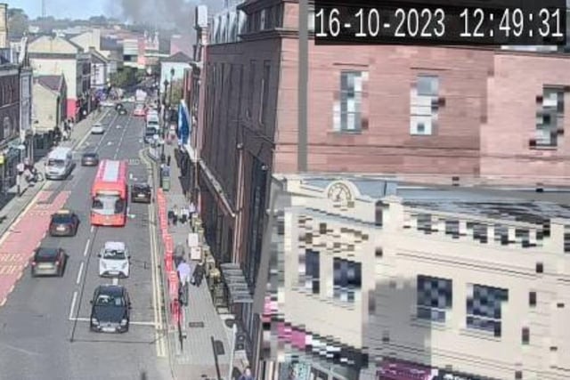 Smoke can be seen billowing from Queen's Court on Monday afternoon.