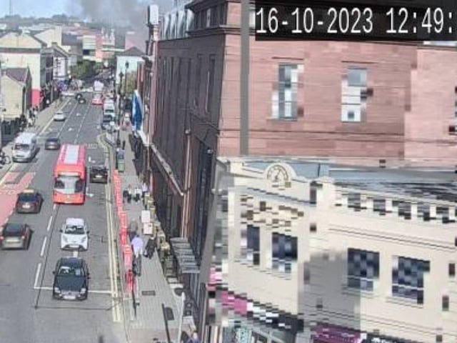 Smoke can be seen billowing from Queen's Court on Monday afternoon.