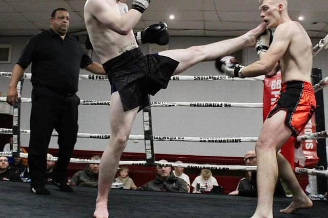 Conal McBrearty (Rath Mor Warriors) lands a strong kick to the chin of his opponent.