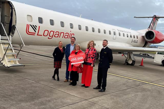Loganair Cabin Crew, Geraldine Parker, Steve Frazer from City of Derry Airport, Passenger Catherine Hill, Lisa Curtiss Marketing Executive at Loganair and First Officer Gareth Webb.