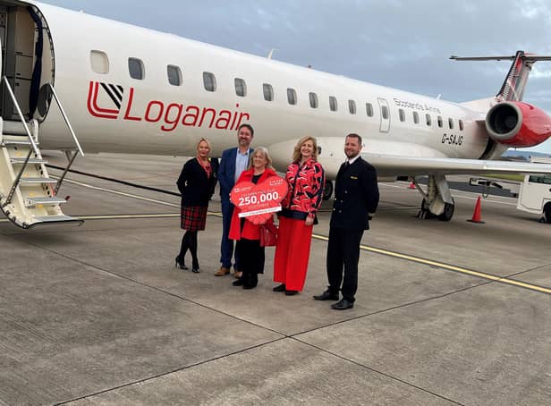 Loganair Cabin Crew, Geraldine Parker, Steve Frazer from City of Derry Airport, Passenger Catherine Hill, Lisa Curtiss Marketing Executive at Loganair and First Officer Gareth Webb.