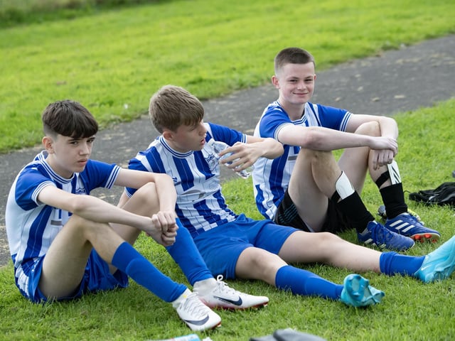 Players from Newry City sit out the second half of Wednesday's clash with Kilmacrennan Celtic at Leafair Park, Derry.