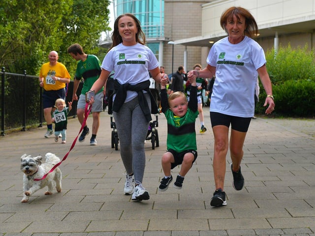 This young man gets a helping hand during the children’s race underway on Thursday evening last. Photo: George Sweeney. DER2326GS - 49