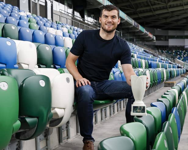 Crusaders' Philip Lowry with September's Dream Spanish Homes Player of the Month award.