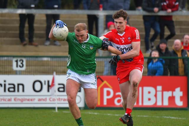 Derry’s Eoin McEvoy grapples with Adrain Enright of Limerick during their Division Two opener at Owenbeg. Photo: George Sweeney. DER2305GS – 140