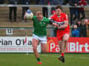 Derry’s Eoin McEvoy grapples with Adrain Enright of Limerick during their Division Two opener at Owenbeg. Photo: George Sweeney. DER2305GS – 140