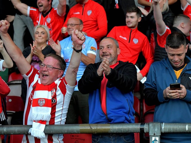 Derry City fans celebrate Will Patching’s winning goal against against Sligo Rovers on Friday evening. Photo: George Sweeney. DER2327GS – 070