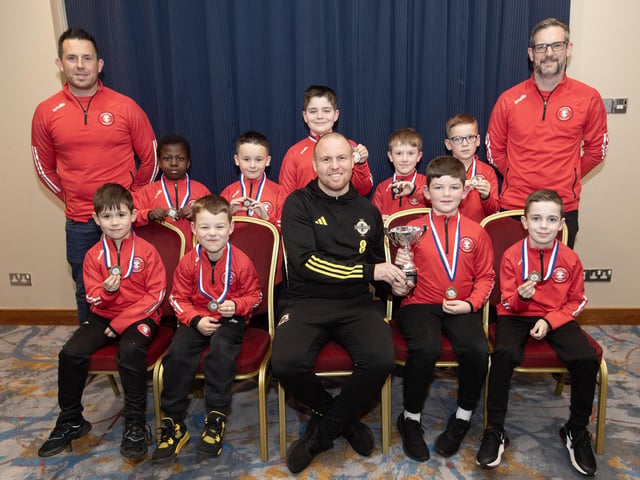 Ronan O'Donnell, Irish Football Association, special guest at the D&D Youth FA Annual Awards at the City Hotel on Friday night presents Tristar U8s with the Summer Cup. Included are coaches Peter Quigley and Joe Doherty.