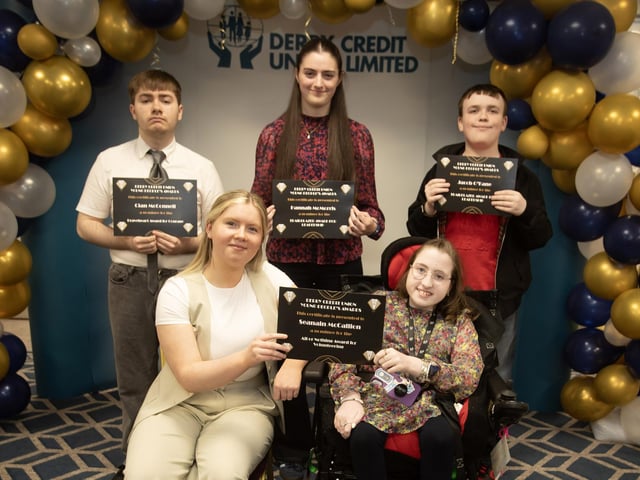 Derry Credit Union's Young People's Awards 2025 nominees being presented with their certificates by Rionach Barr, Youth Committee, on Monday night. At front is Seanain McCallion, and back from left, Cian McConnell, Hannah McMorris and Jacob O'Kane.