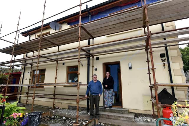 Danny and Kate Rafferty at the rear of their home which was built with blocks that turned out to defective. Photo: George Sweeney.
